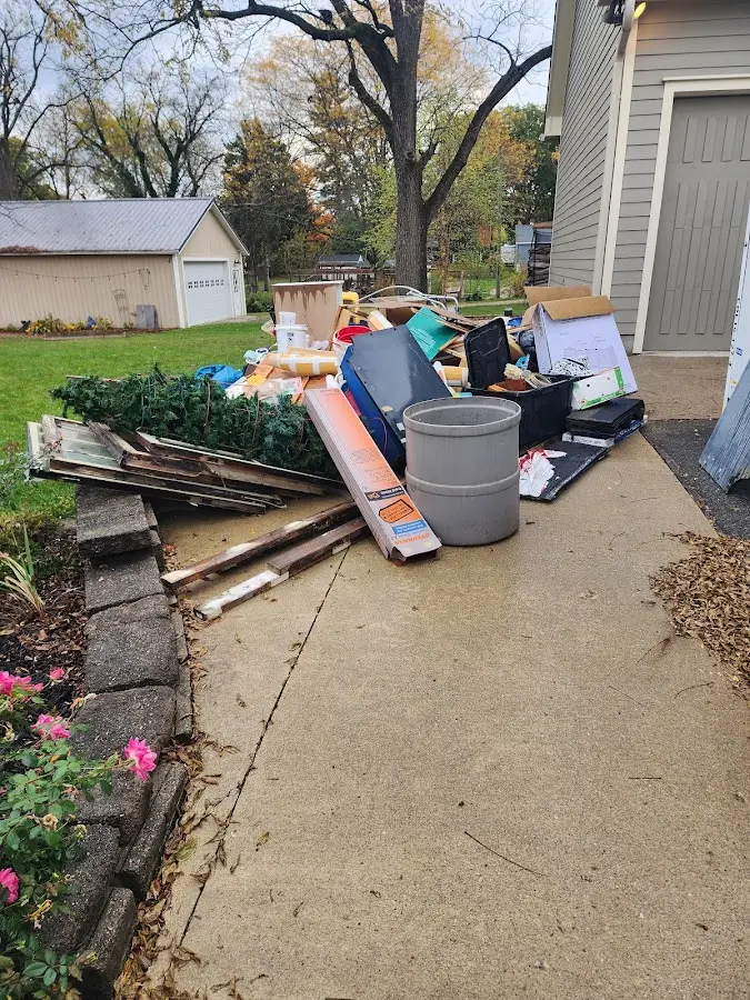 Dumpster being loaded with debris for Estate Cleanout Dumpster Rental in Waynesboro
